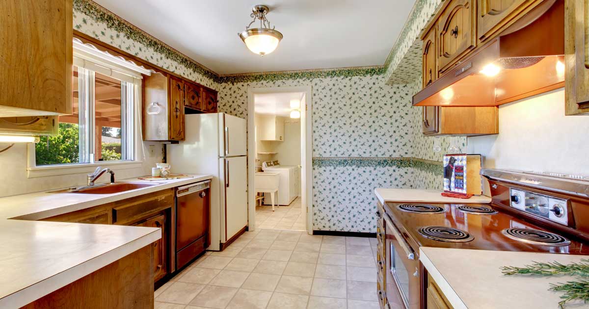 80s style kitchen with green wallpaper and brown appliances