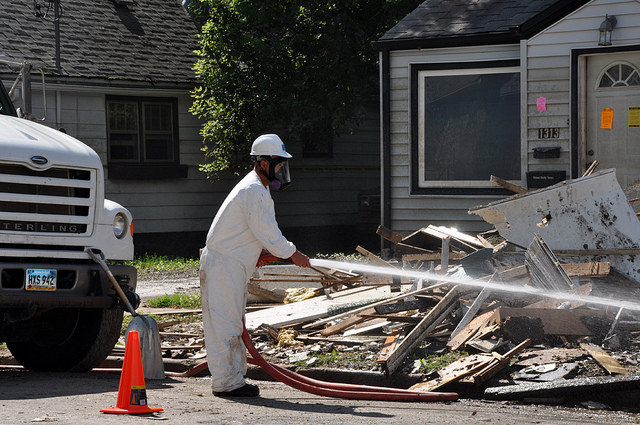 A person removing asbestos.