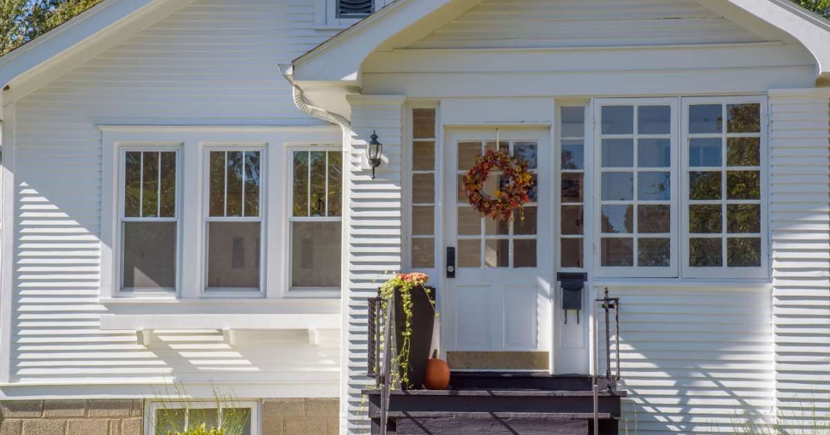 facing front of white house with windows